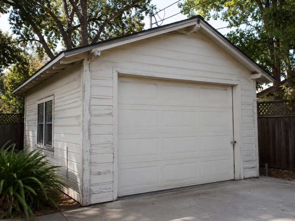 Detached garage in Santa Barbara backyard before ADU conversion near rear property line