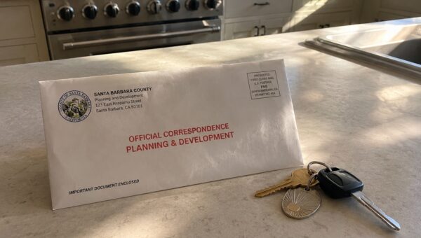 Official notice of violation envelope on a Santa Barbara homeowner's kitchen counter