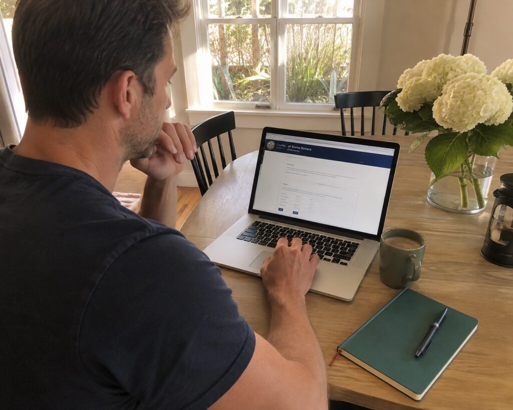 Homebuyer reviewing a permit history Santa Barbara report before closing
