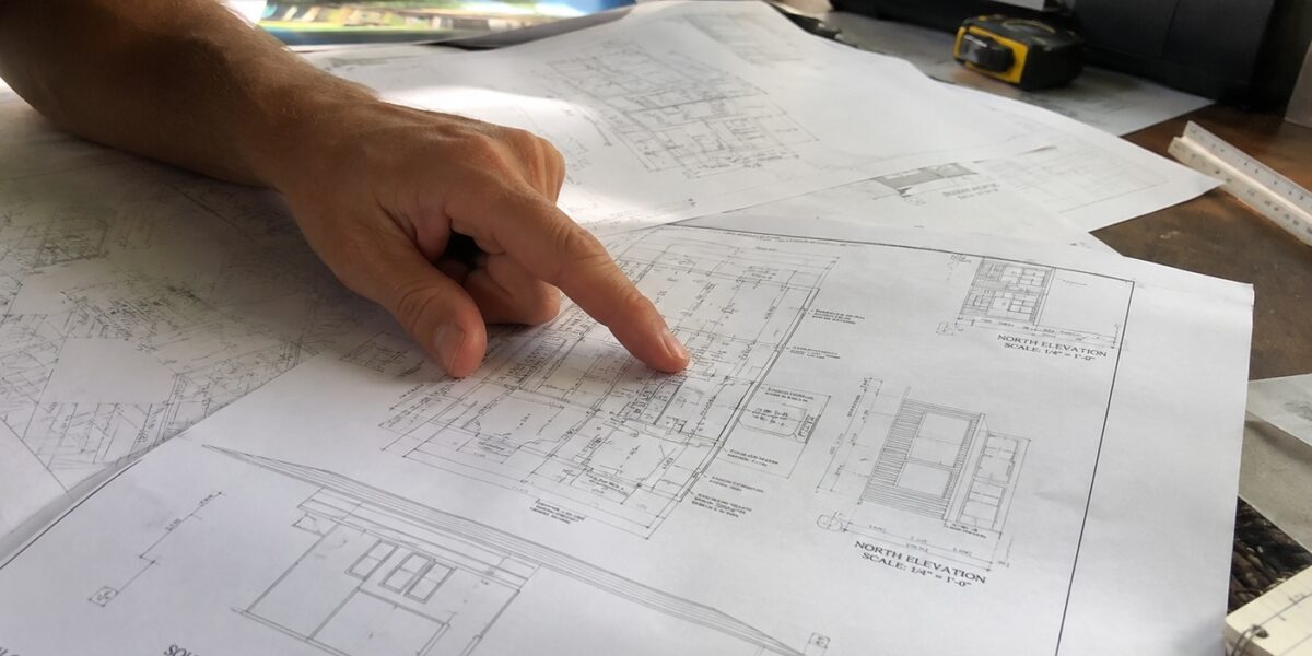 Homeowner and drafter reviewing a feasibility study Santa Barbara property assessment